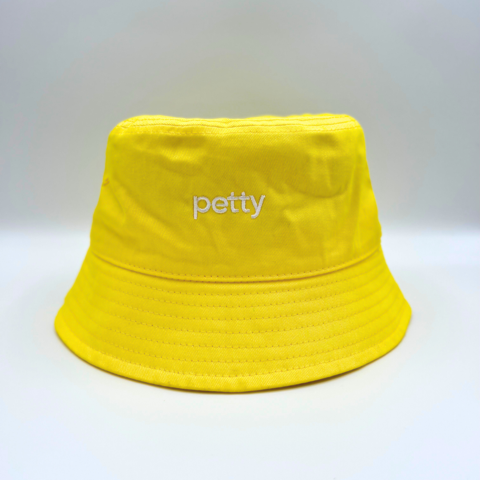 yellow bucket hat with word petty in white color